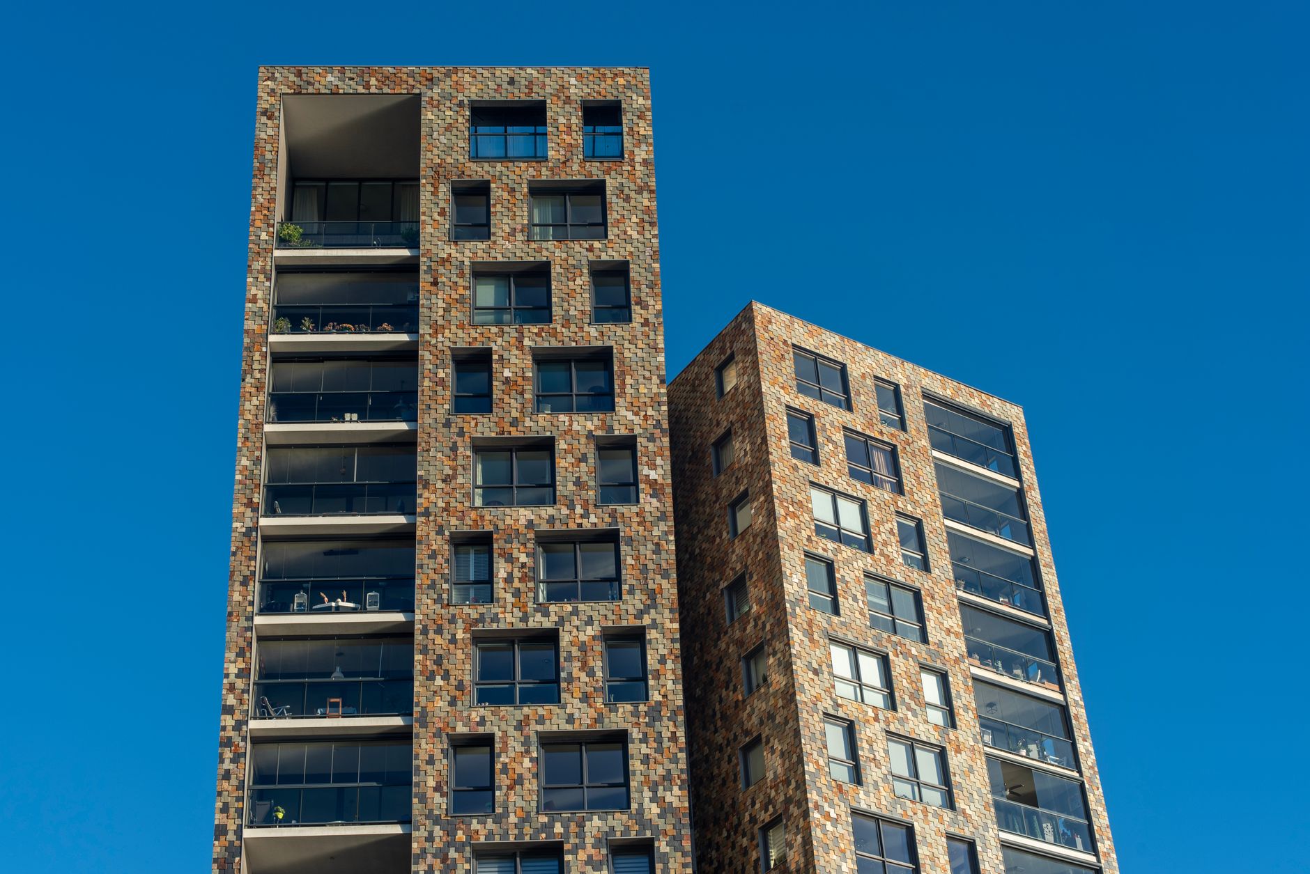 Completed Crestmark residential tower against a clear sky